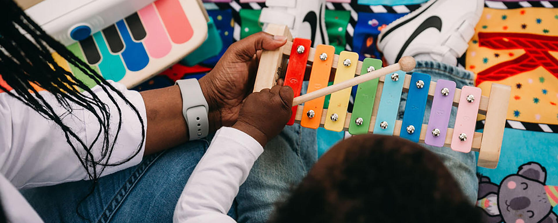 hand holding xylophone for child