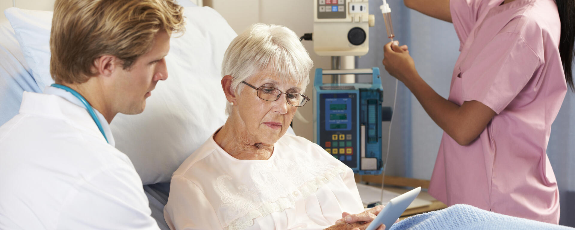 male doctor speaking with a female patient