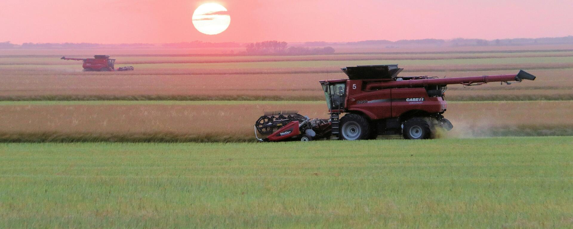 Combine harvester on a farm