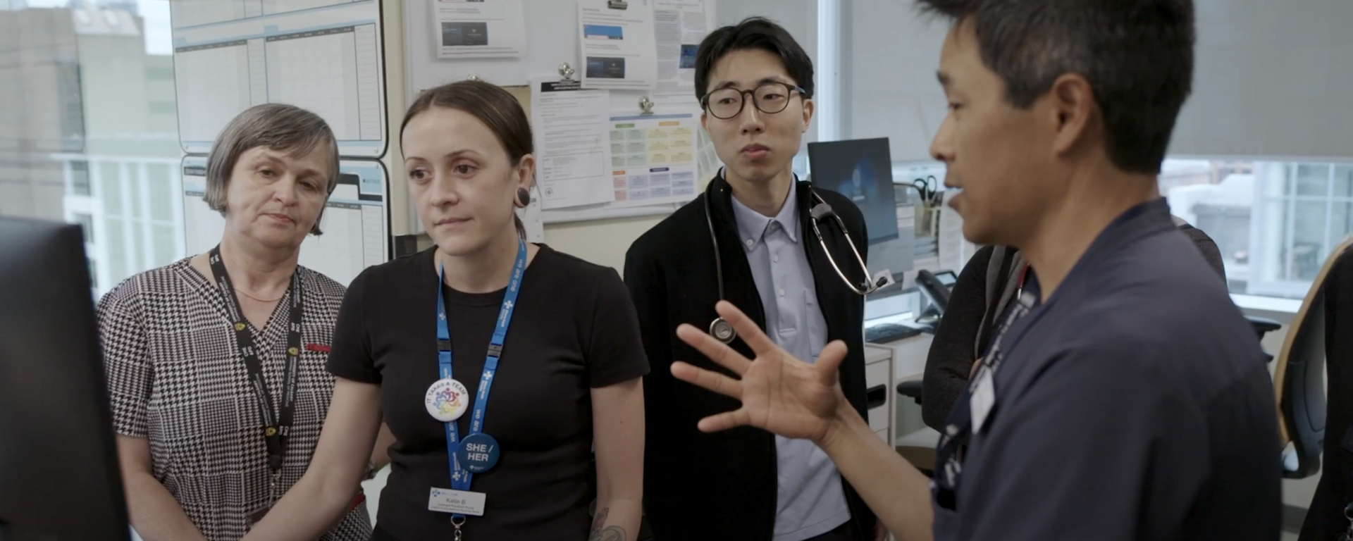 residents talk with preceptor in clinic office