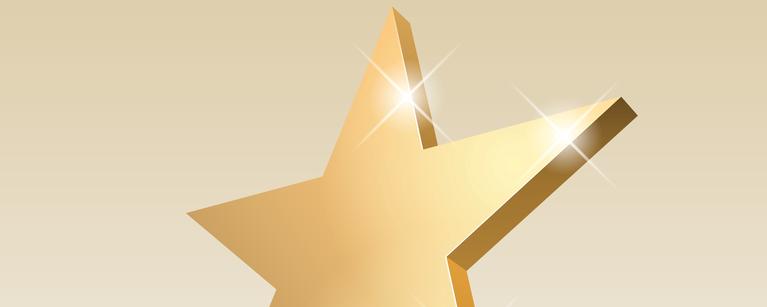 sparkling gold star on pedestal