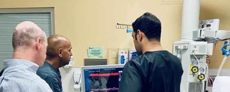 Fellowship banner, learners and instructor