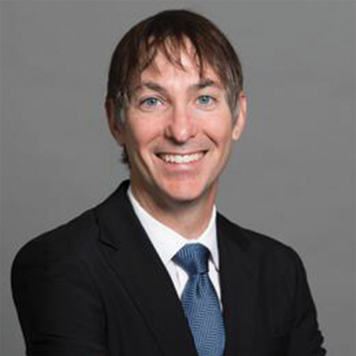 Dr. Marcello Tonelli, Professor of Medicine and nephrologist at the University of Calgary, in a professional headshot with a neutral background.