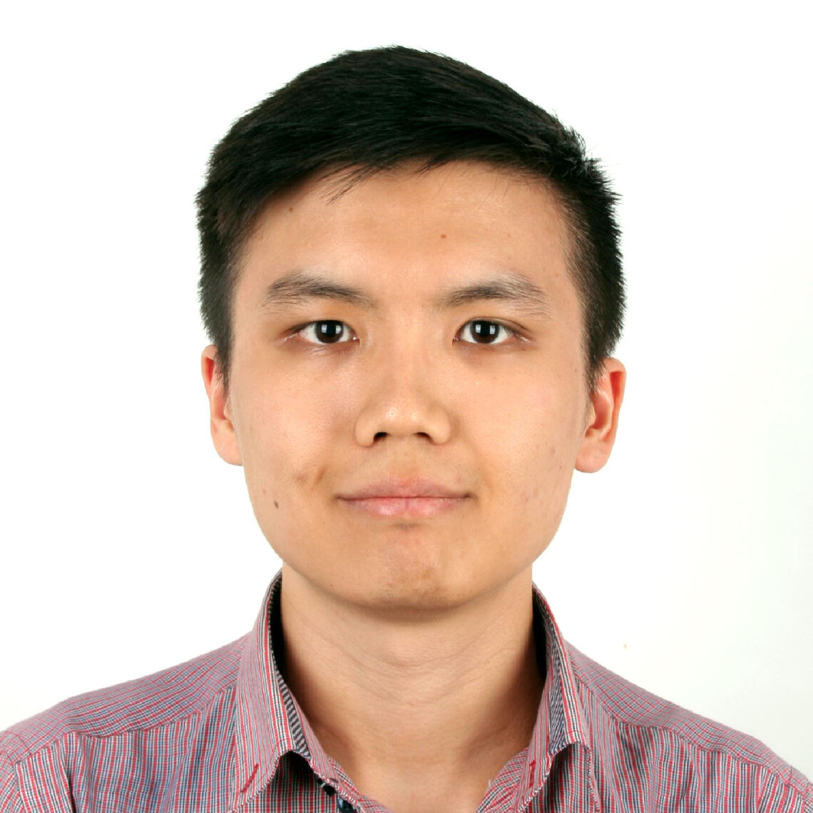 Dr. Christian Chan, ICDC Postdoctoral fellow, smiling in a professional headshot with a white background