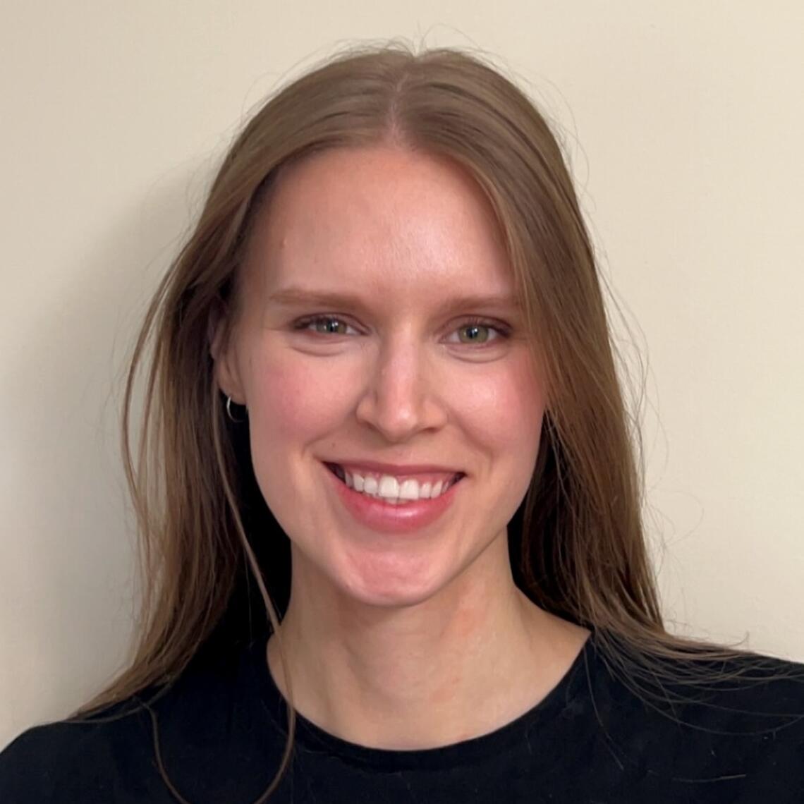 Meghan Harris, Master's Student, smiling in a professional headshot with a neutral background