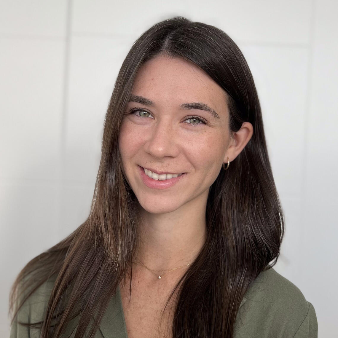 Megan Howarth, Master's Student, smiling in a professional headshot with a neutral background