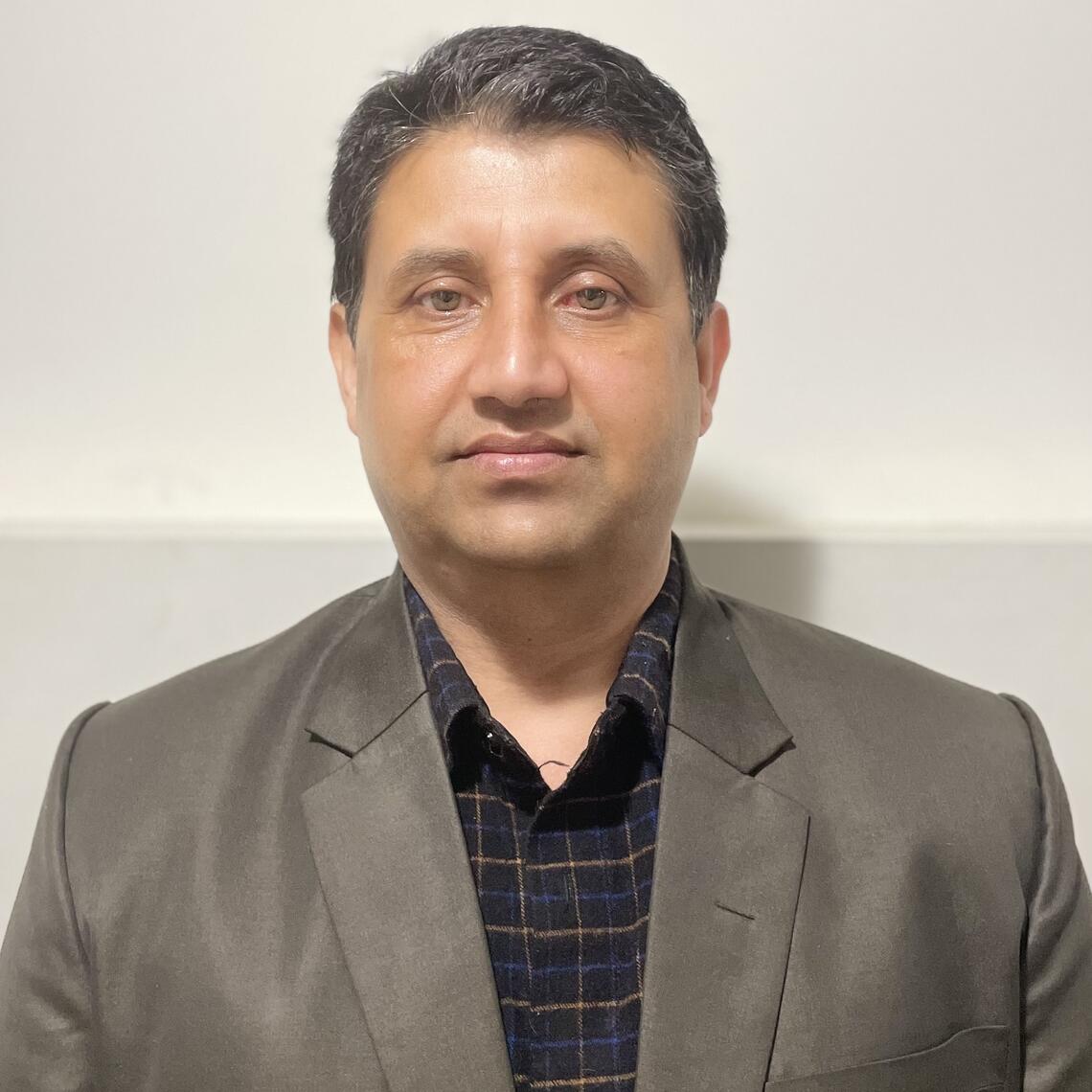 Dr. Dilaram Acharya, ICDC Postdoctoral fellow, professional headshot with a neutral background