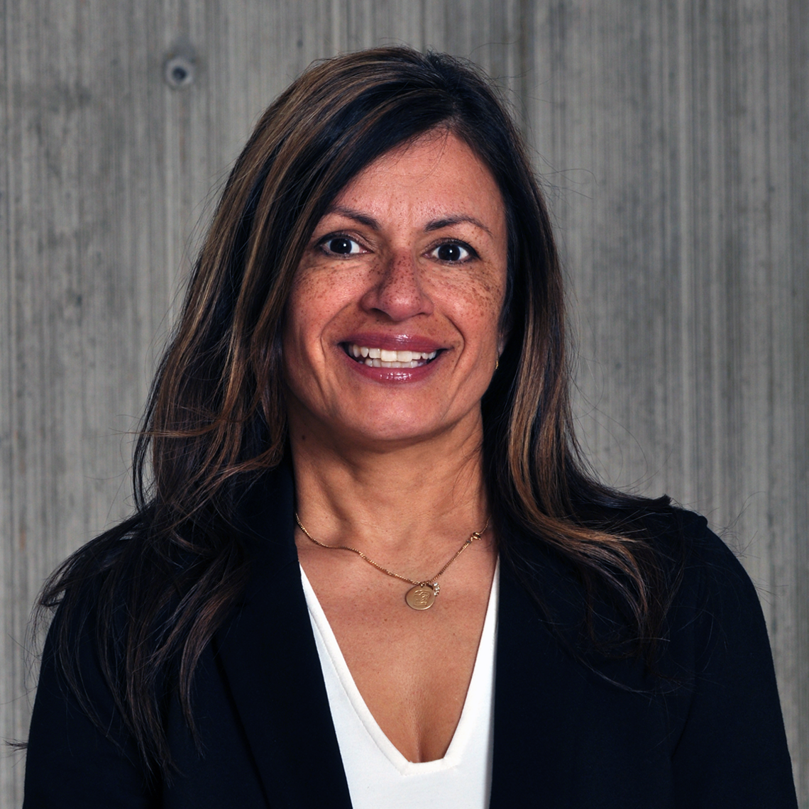 Dr. Maoliosa Donald, Adjunct Assistant Professor and implementation scientist at the University of Calgary, in a professional headshot with a neutral background