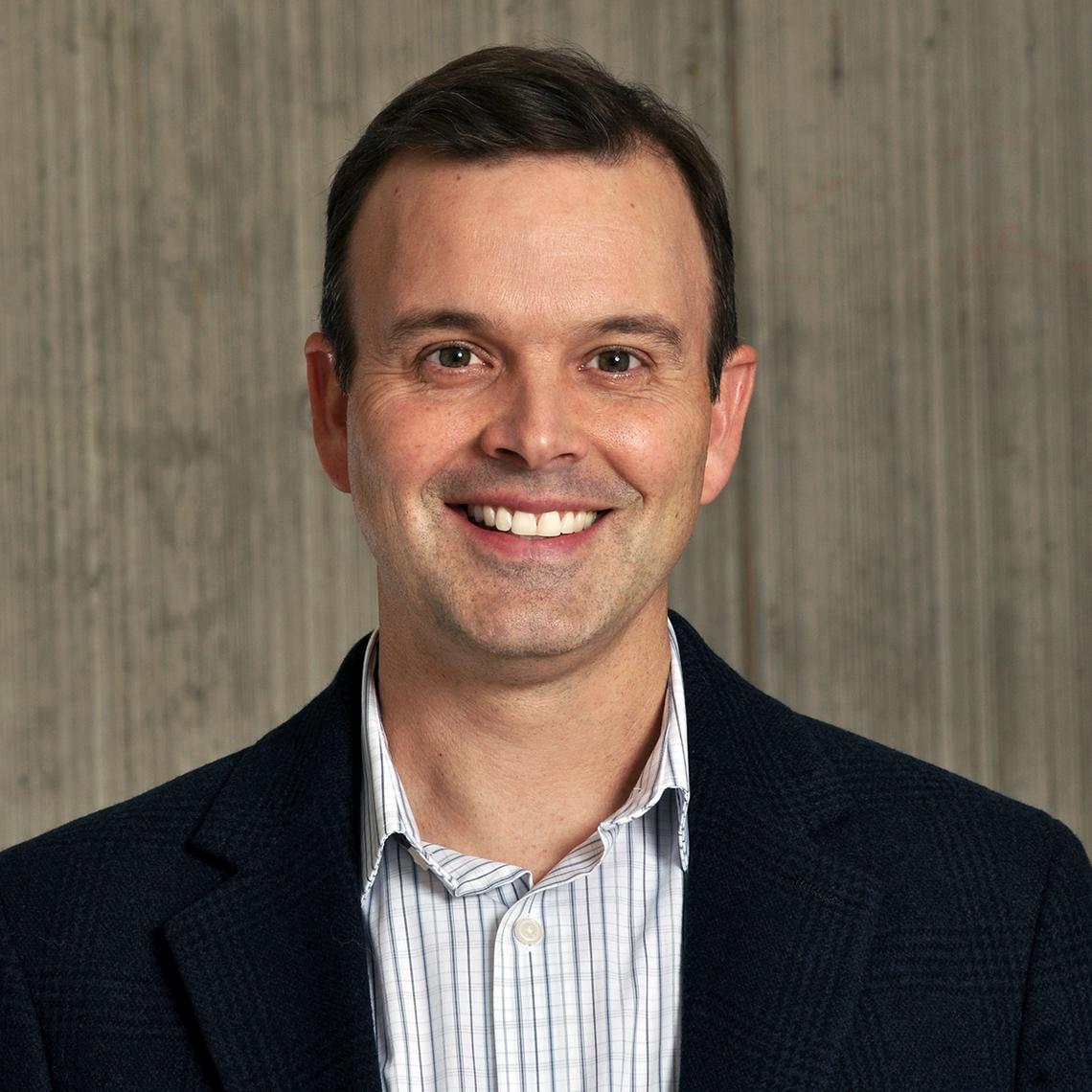 Dr. Paul Ronksley, Associate Professor and health services researcher at the University of Calgary, in a professional headshot with a neutral background.