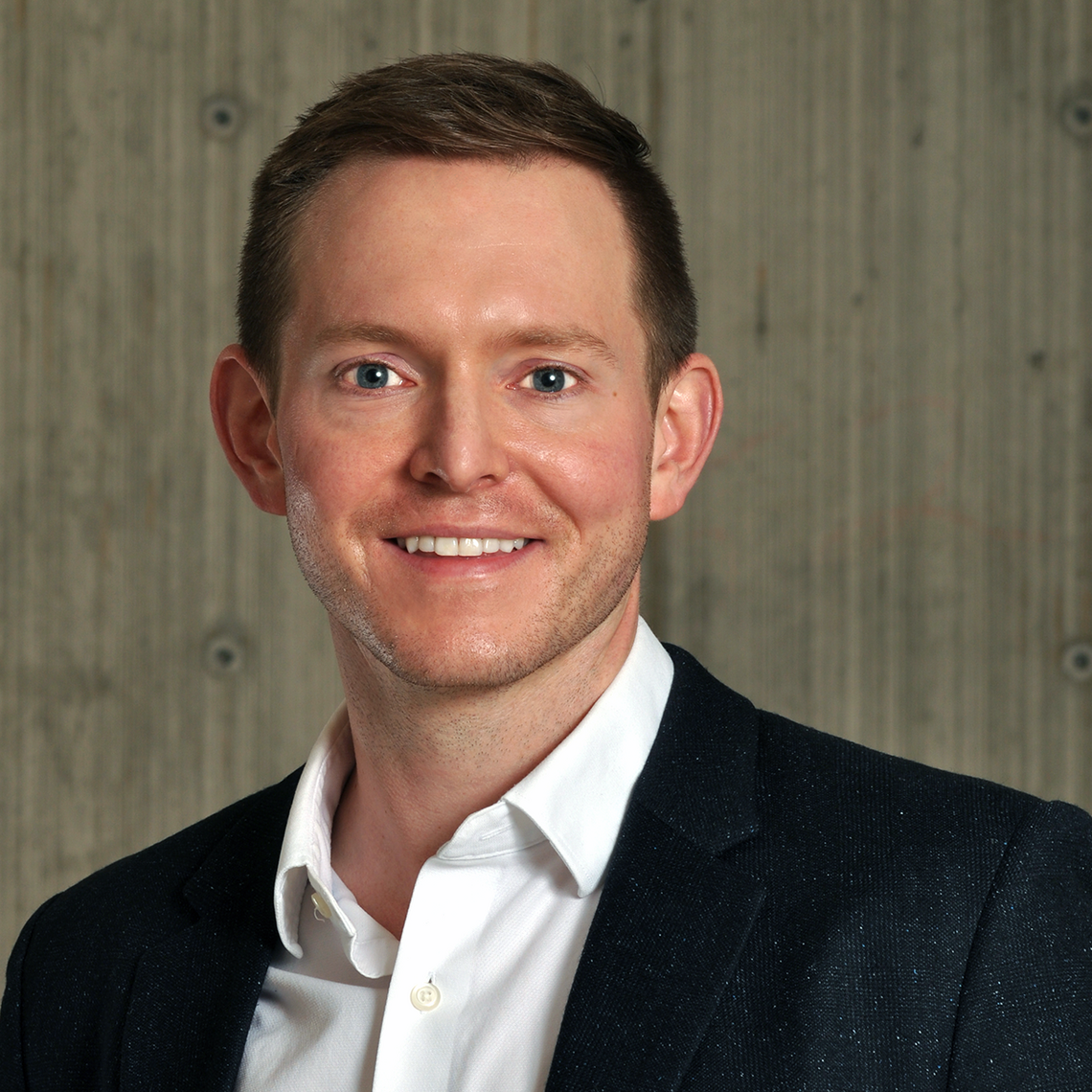 Dr. Tyrone Harrison, Assistant Professor and Nephrologist at the University of Calgary, in a professional headshot with a neutral background