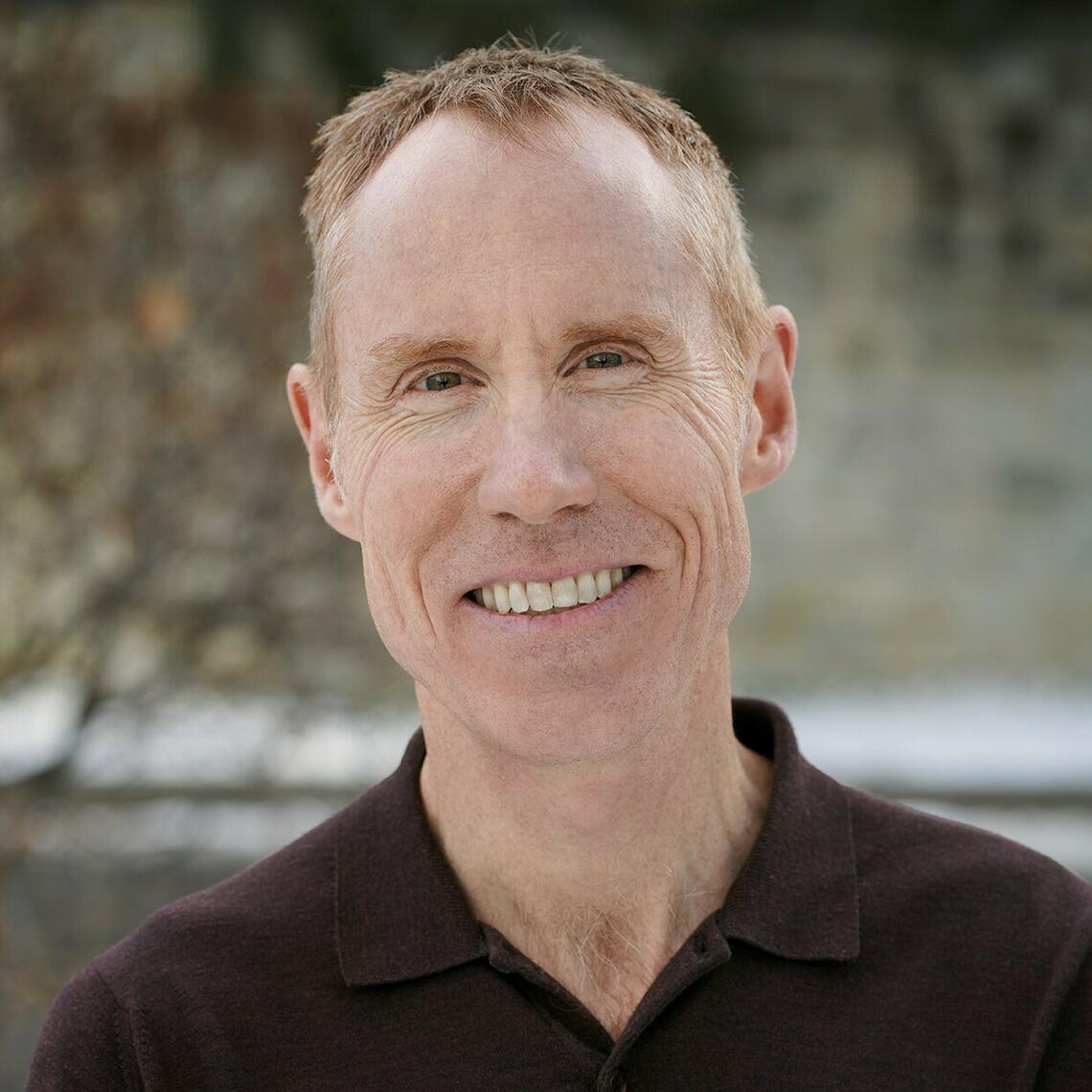 Dr. Braden Manns, Professor of Medicine and Senior Associate Dean of Health Research at the University of Calgary, in a professional headshot with a neutral background.