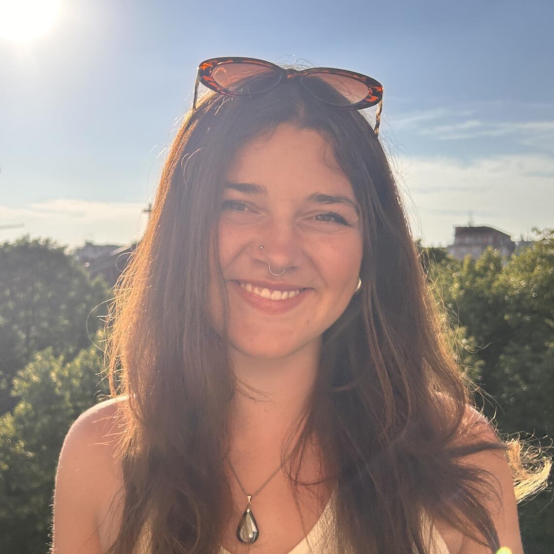 smiling young woman with long brown hair