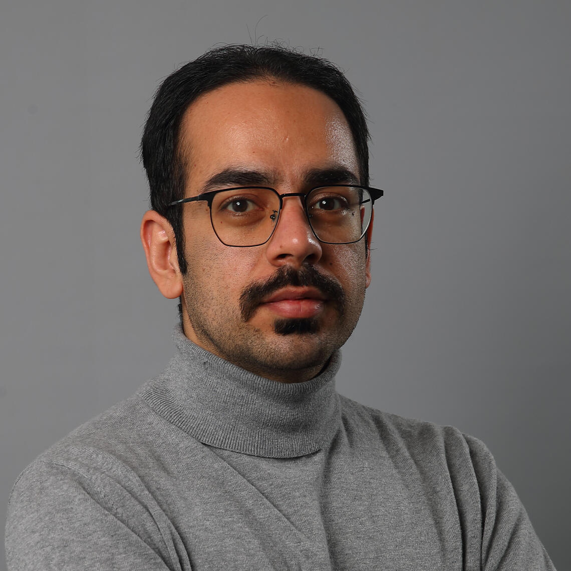 man with glasses and dark hair