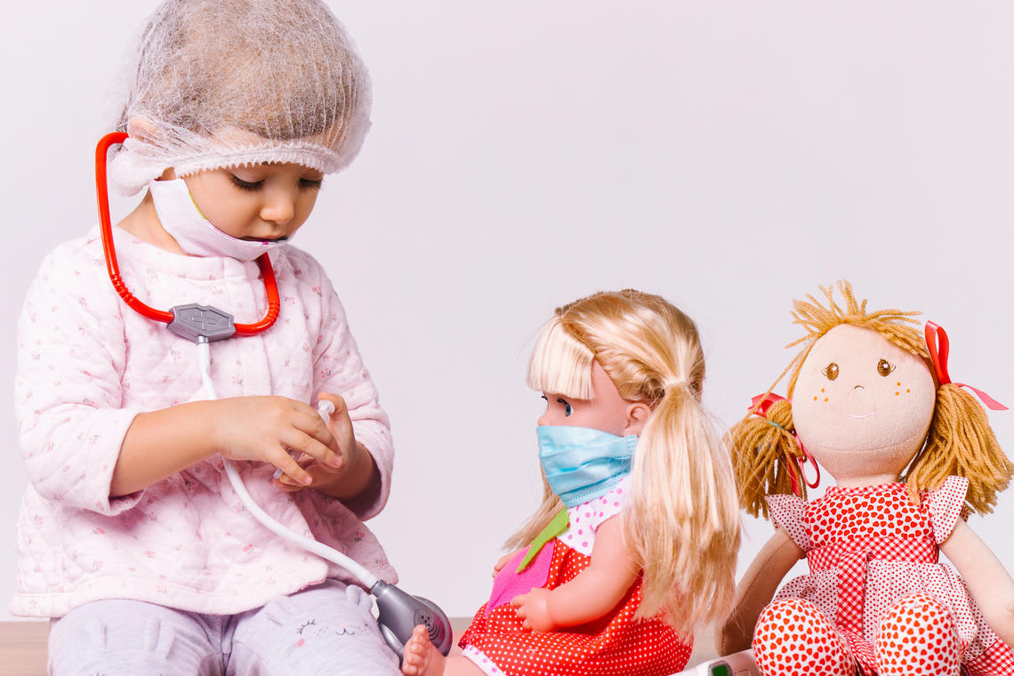 girl with dolls, playing doctor