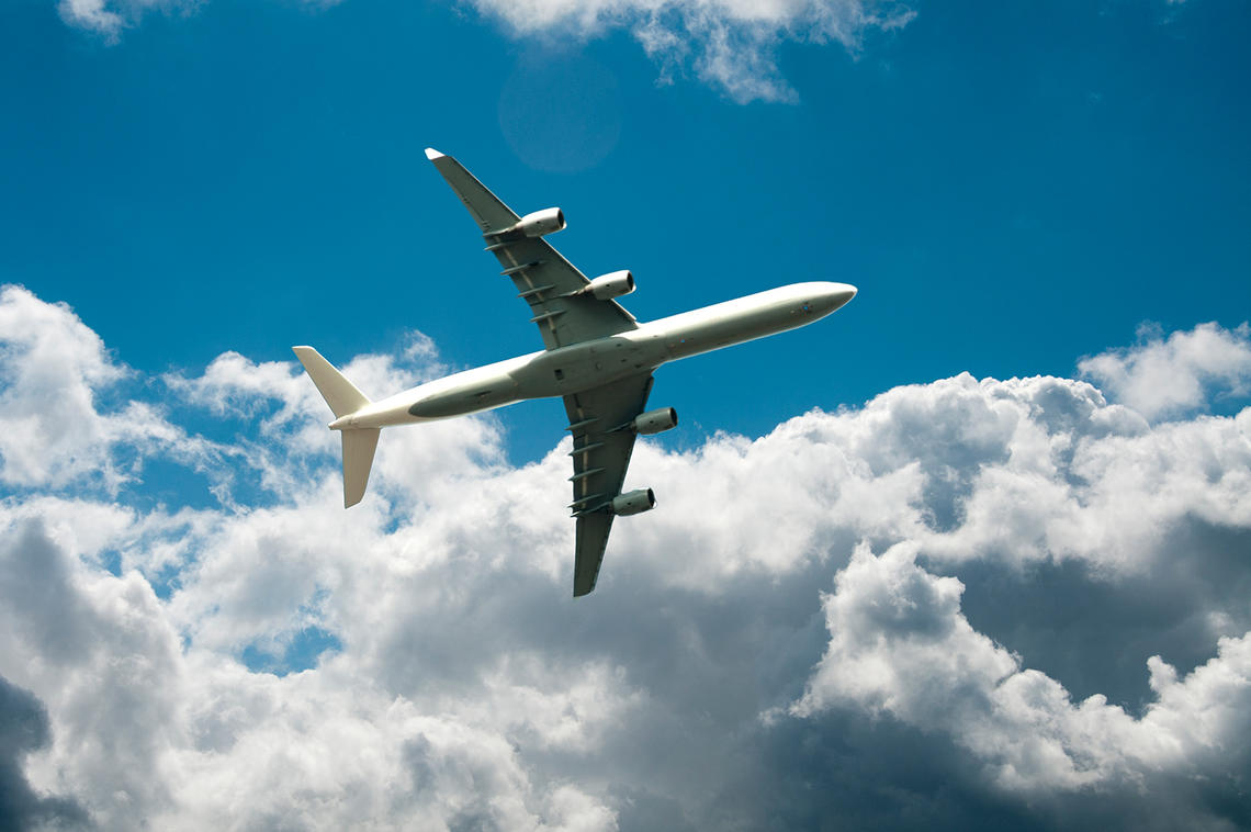 Plane flying above clouds.