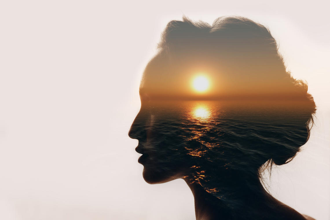 Woman with sun's reflection on her face