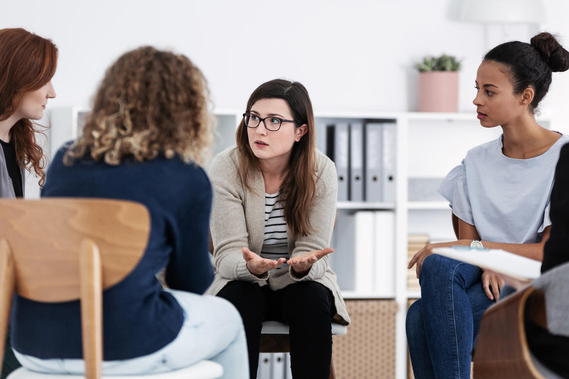 Psychologists talking in a classroom