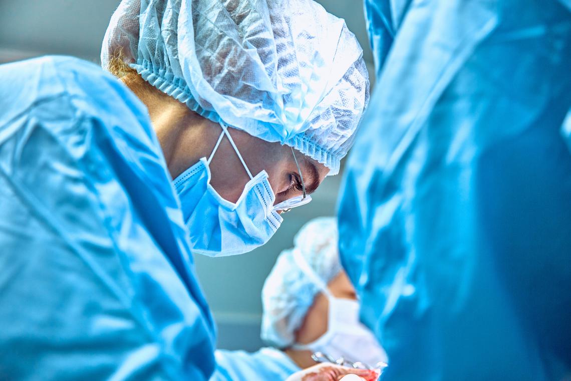 Female surgeon operating