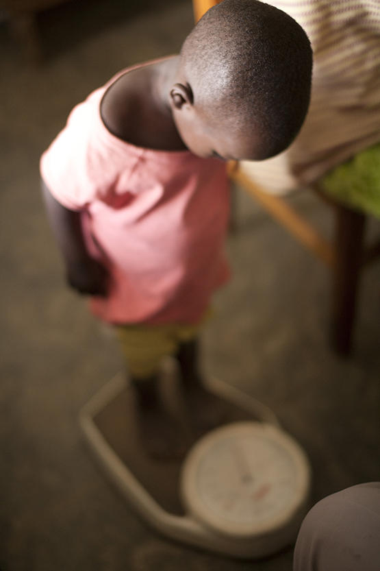 child standing on a scale