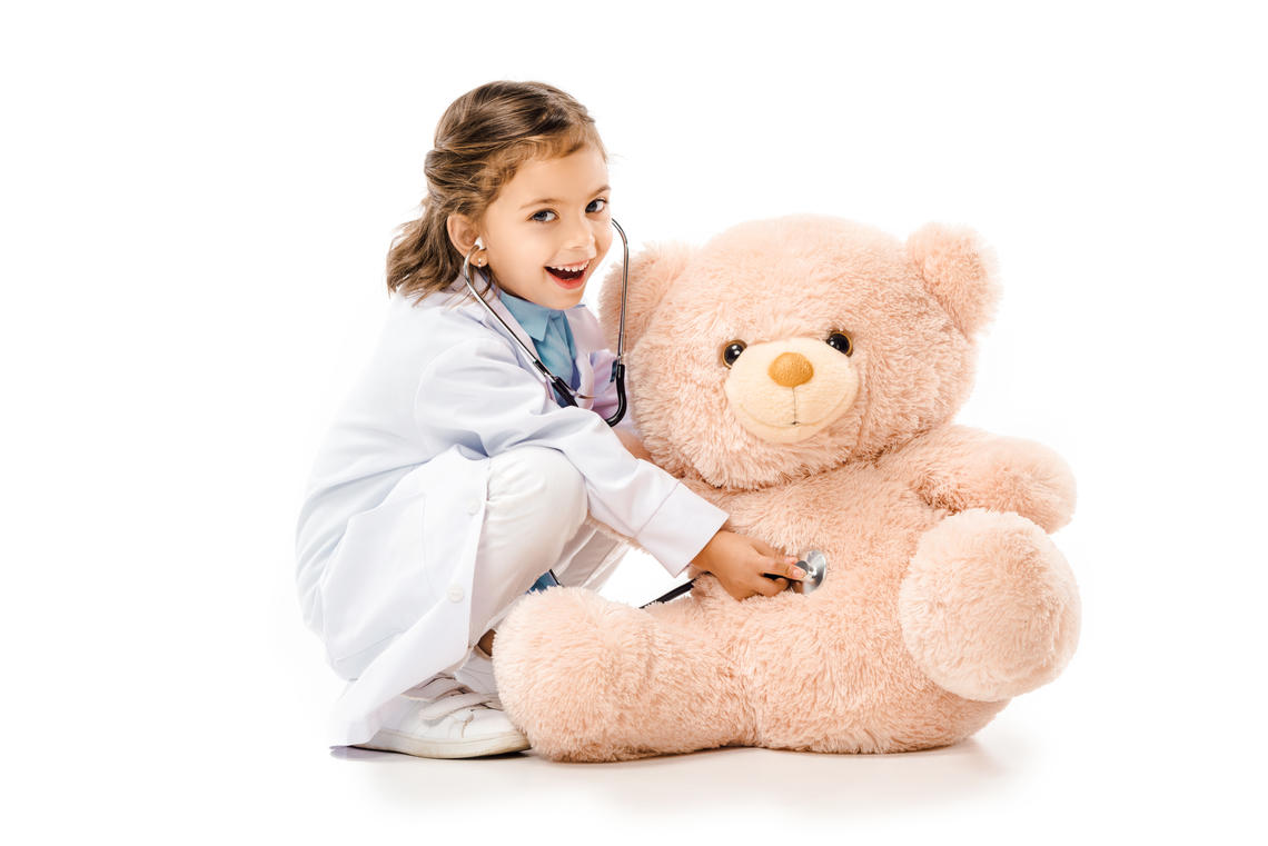 Girl doctor with teddy bear