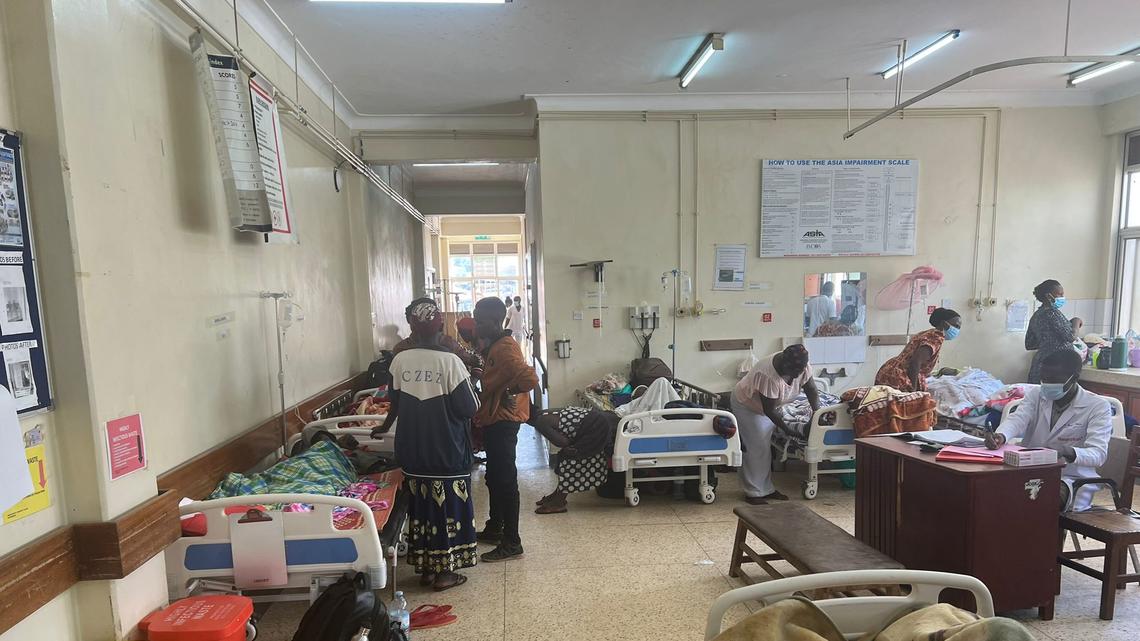 a photo of a hospital room in southwest Uganda with hospital staff and patients