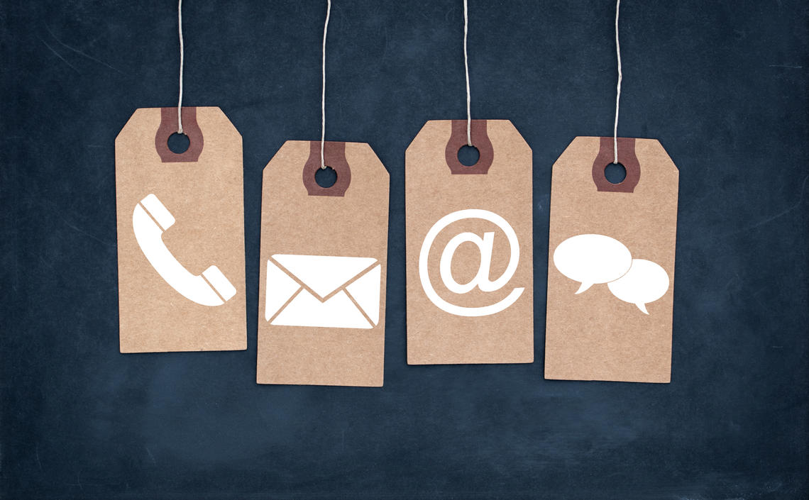 Four dangled labels with contact icons on each one
