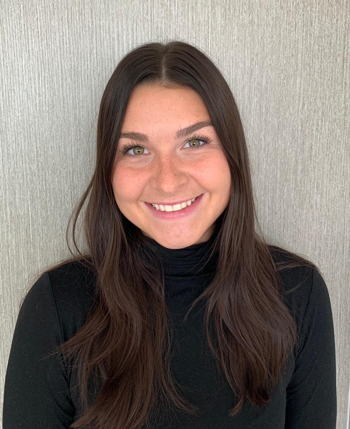 Photo of Maureen O'Brien - caucasian female with long brown hair and a big smile