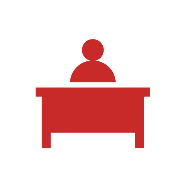 Red image of someone sitting behind a desk