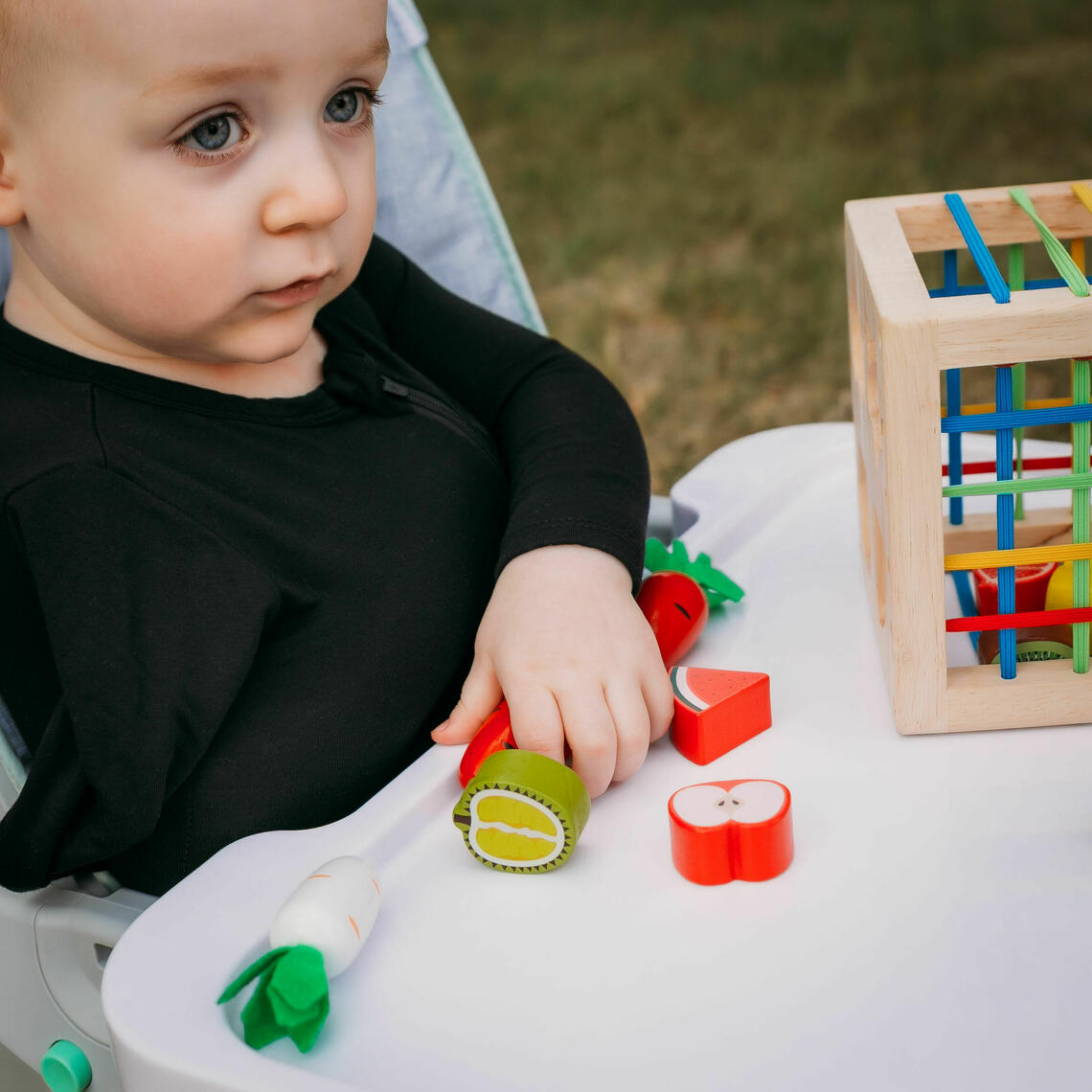 child with lots of toys