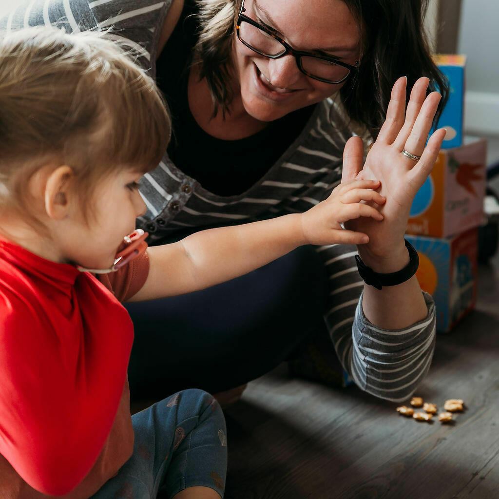 child giving mom high five