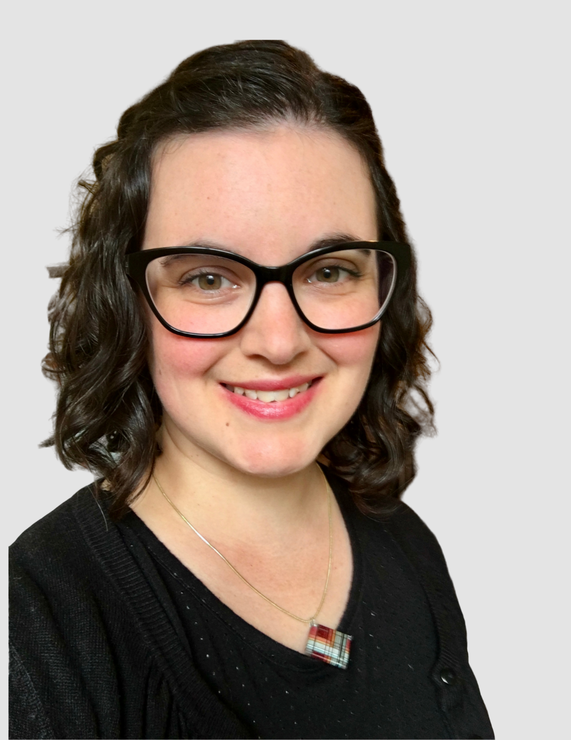 Caucasian female with brown shoulder length hair, glasses, and black shirt