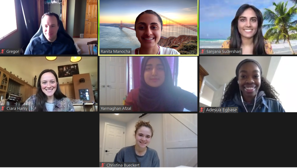 7 boxes, each containing an image of a lab member in a virtual meeting. The members are smiling.