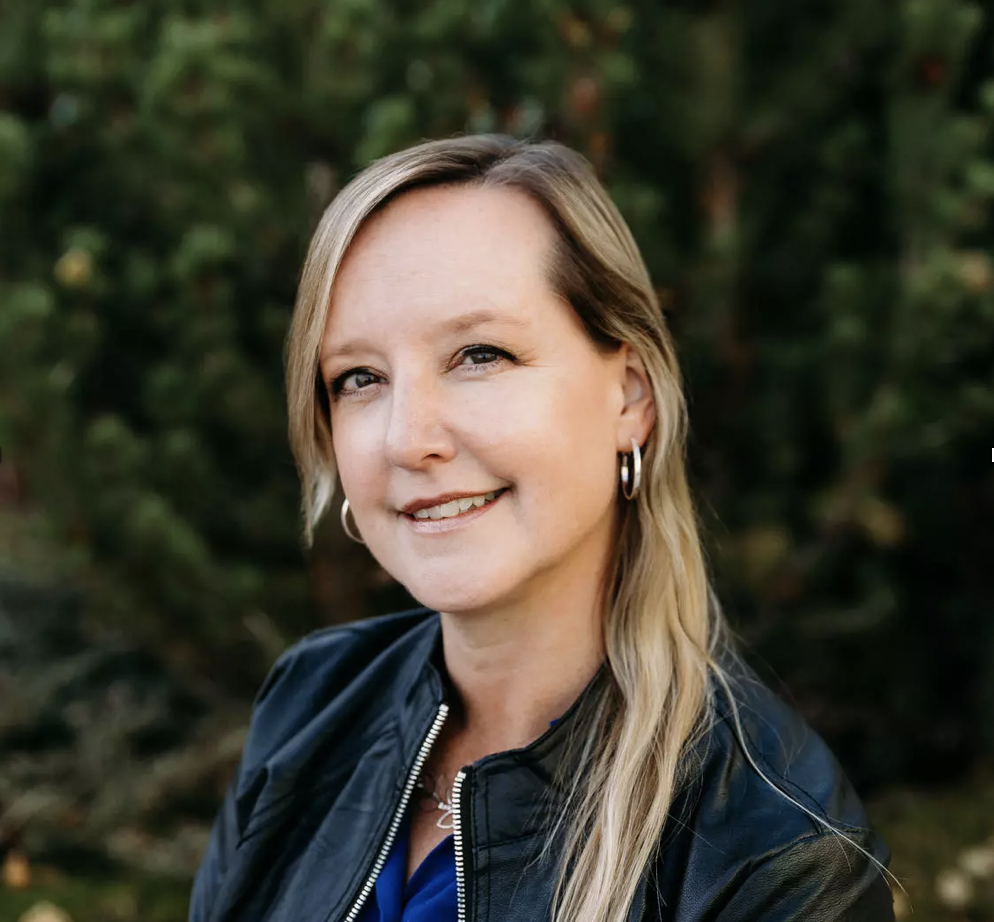 Helen Carlson, smiling woman with long blonde hair and light skin