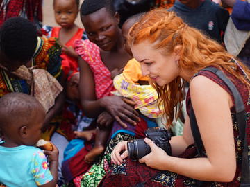 Ashley Anderson interacts with mothers and babies, Ngudu, Kwimba