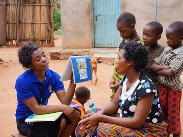 A CHW visits an expecting family to discuss healthy practices. Mbarika, Misungwi