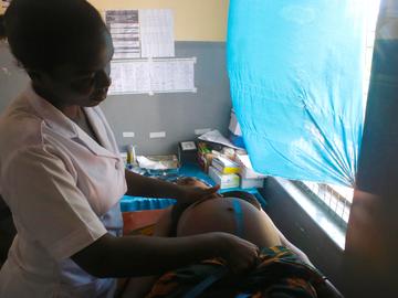 A pregnant mother attends her final routine prenatal check up before giving birth, Ngudu, Kwimba
