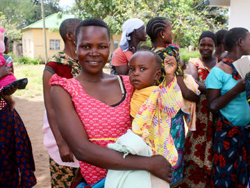 A mother and her child pose while waiting for a routine check up, Ngudu, Kwimba