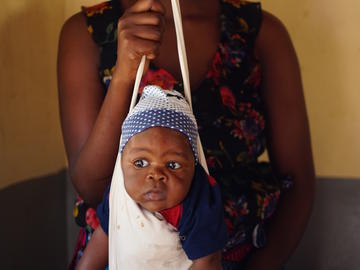 A baby is weighed at the Ngudu Health Facility, Kwimba