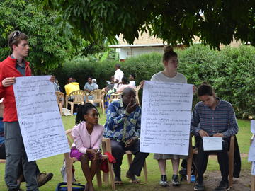 A group of students and community members talking