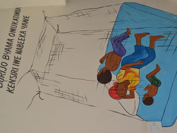 A mural of a family sleeping protected by a mosquito net. 