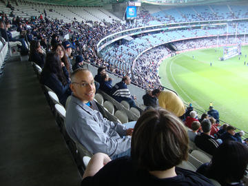 Louis Lauzon and Cheryl McCreary watching a Australian football league (footy) match. Melbourne, Australia, May 2013.