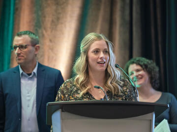 Dr. Ashley Rommens speaking at the Cabin Fever 2025 