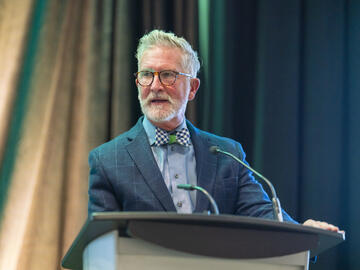 Dr. Douglas Myhre speaking at the Cabin Fever 2025 conference