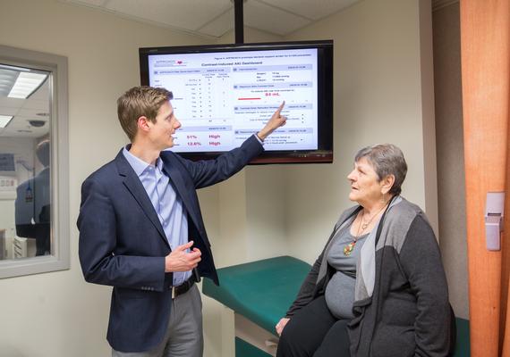Dr. Matthew James talking to a senior female patient
