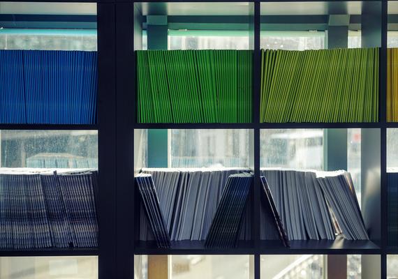 Notebooks on bookshelves