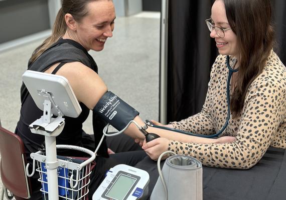 Person getting their blood pressure checked by a CSEP certified individual