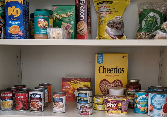 Picture of pantry shelves with a variety of dry goods food items.