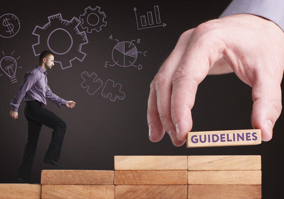 Man walking on blocks towards guidelines