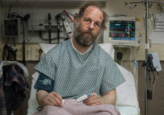 a man sitting in a hospital bed