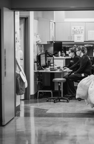 Healthcare worker sitting at computer